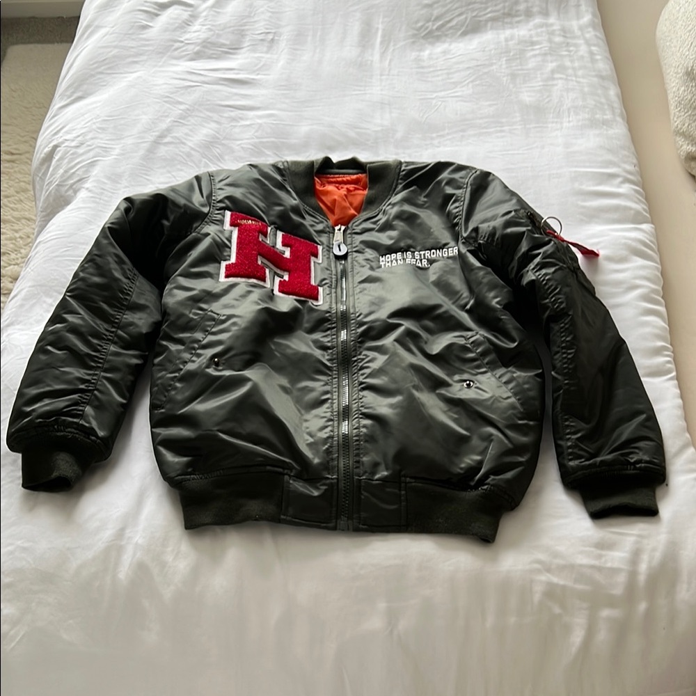 Green Bomber Jacket with Red and White Patches